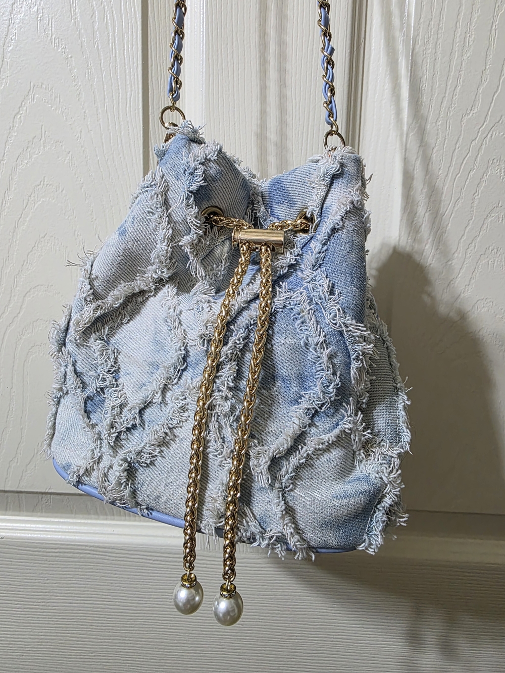 Light Blue Distressed Denim Drawstring Shoulder Bag